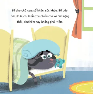 Chú mèo lo lắng trốn dưới gối tránh tiêm